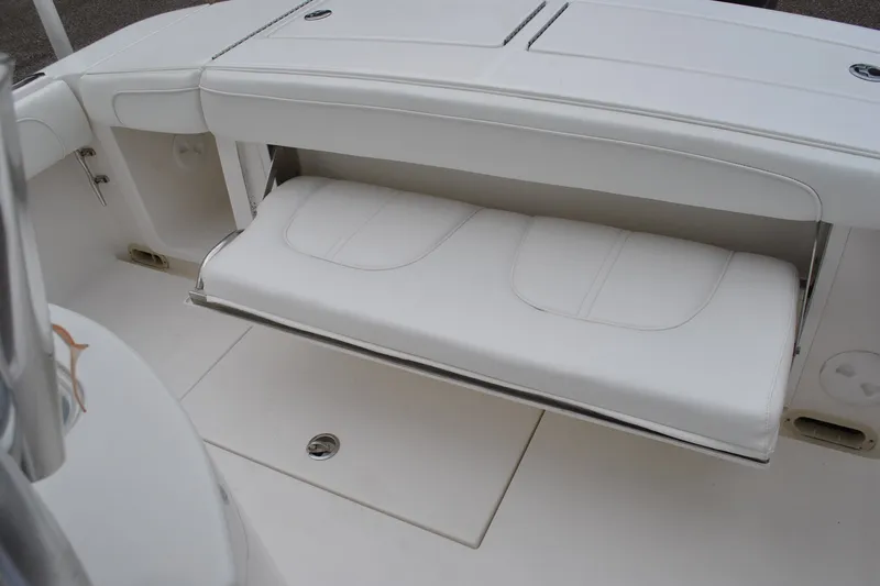 Slide: The Image of 2016 Regulator 28 Forward Seating boat with white cushioned seat. - 44
