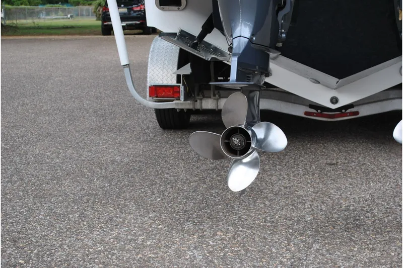 Slide: The Image of 2016 Regulator 28 Forward Seating boat propeller on trailer, close-up view. - 12