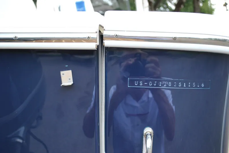Slide: The Image of 2016 Regulator 28 Forward Seating boat with visible hull identification number. - 9