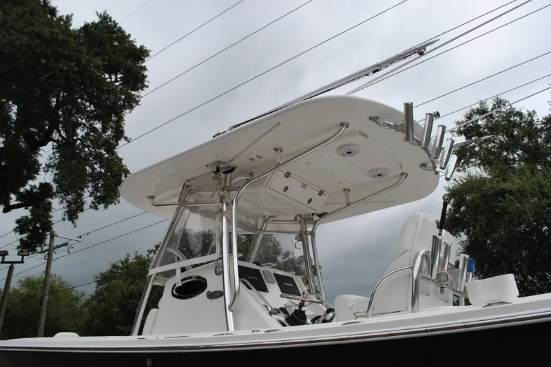 Slide: The Image of 2016 Regulator 28 Forward Seating boat with T-top and rod holders, viewed from below. - 50