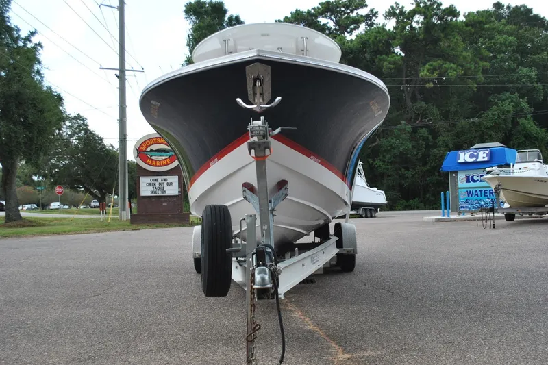 Slide: The Image of 2016 Regulator 28 Forward Seating boat on trailer at Sportsman Marine dealership. - 4