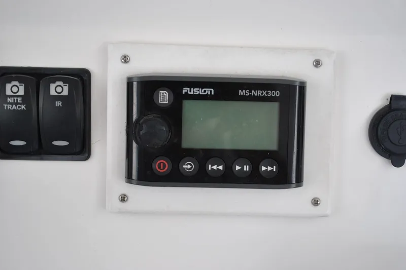Slide: The Image of Control panel on a 2016 Regulator 28 Forward Seating boat featuring Fusion MS-NRX300. - 20