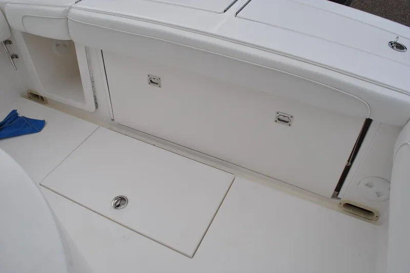 Slide: The Image of 2016 Regulator 28 Forward Seating boat interior with storage compartments. - 31