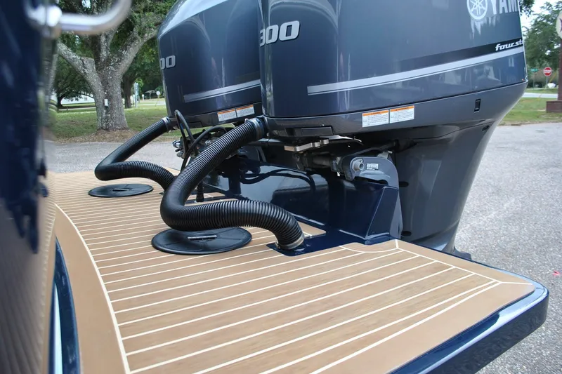 Slide: The Image of 2016 Regulator 28 Forward Seating boat with dual Yamaha 300 engines, rear deck view. - 47