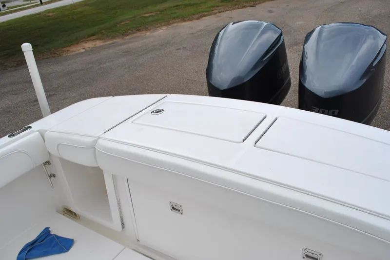 Slide: The Image of 2016 Regulator 28 Forward Seating boat with dual outboard engines. - 33