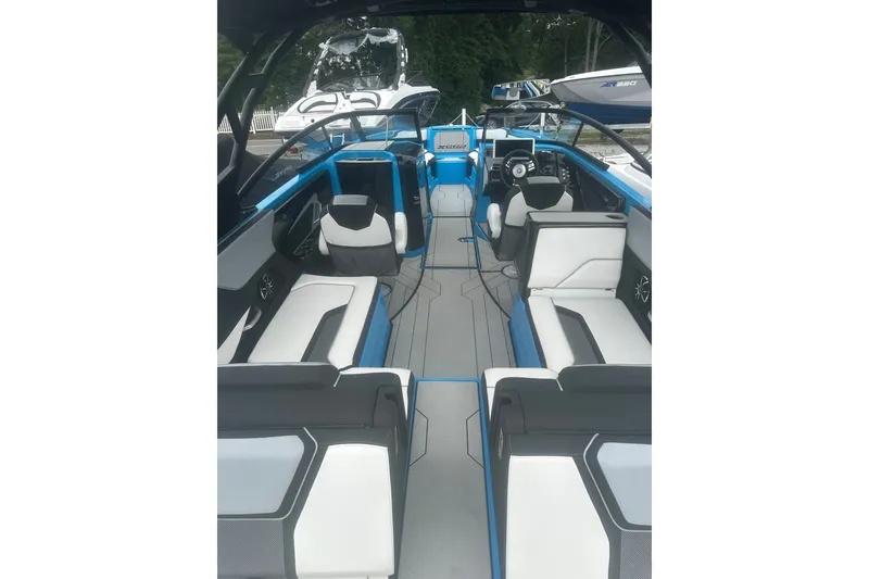 Slide: The Image of 2021 Yamaha Boats 255XE interior with modern seating and sleek design. - 7