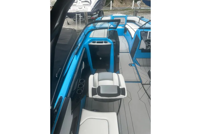 Slide: The Image of 2021 Yamaha Boats 255XE interior with modern seating and sleek design. - 8