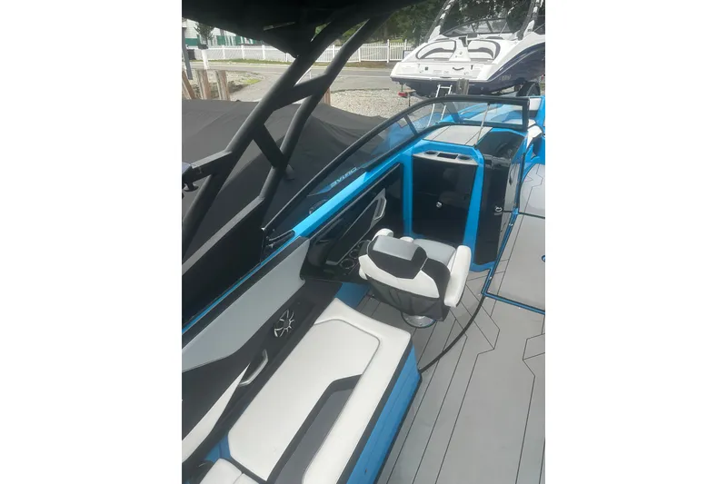 Slide: The Image of 2021 Yamaha Boats 255XE interior with sleek seating and modern design. - 5