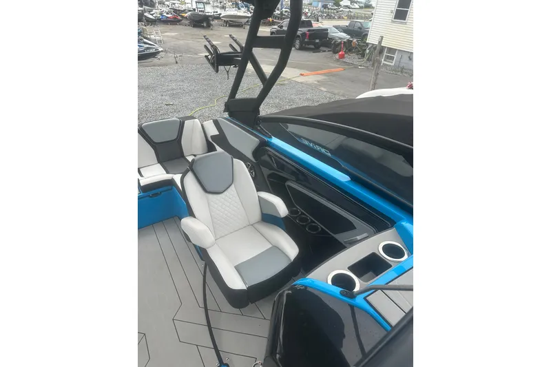 Slide: The Image of 2021 Yamaha Boats 255XE interior with modern seating and sleek design. - 18