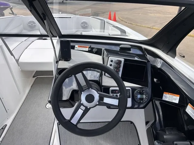 Slide: The Image of The 2024 Yamaha AR220 cockpit features a modern steering wheel and digital display. - 14