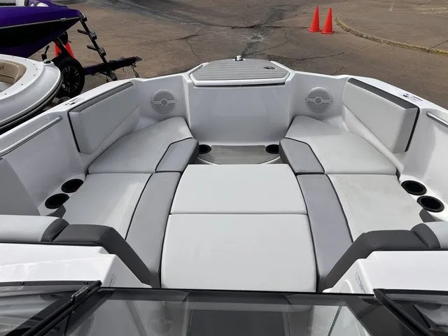 Slide: The Image of The 2024 Yamaha AR220 features a spacious, cushioned seating area with cup holders and speakers. - 18