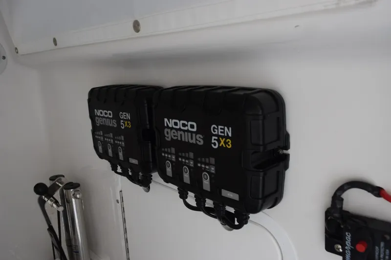Slide: The Image of NOCO Genius GEN 5X3 chargers installed on 2023 Sea Hunt Gamefish 27CB boat. - 20