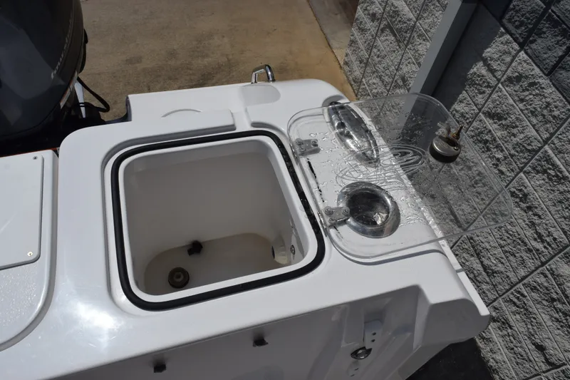 Slide: The Image of 2023 Sea Hunt Gamefish 27CB boat livewell and storage compartment detail. - 27