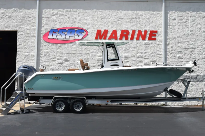 The Image of 2023 Sea Hunt Gamefish 27CB boat on trailer at GSPS Marine dealership. - 1