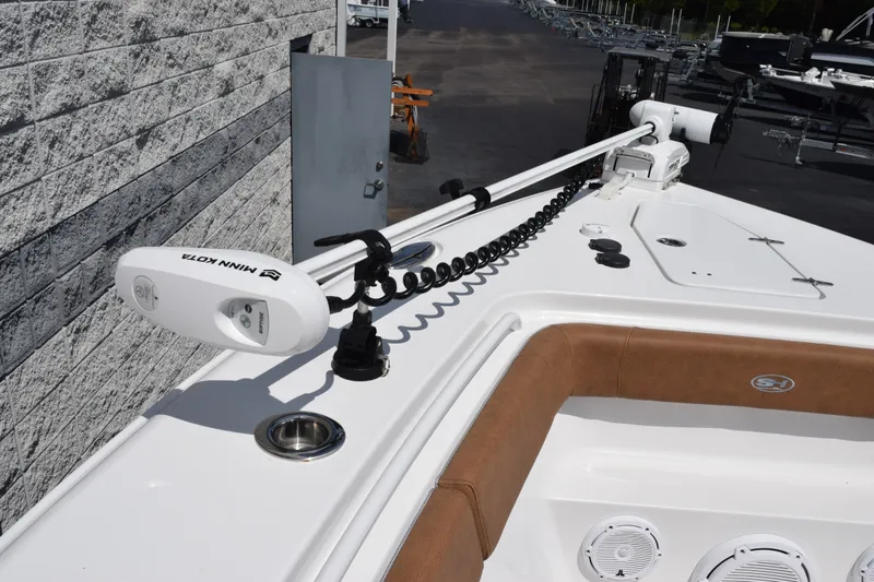 Slide: The Image of 2023 Sea Hunt Gamefish 27CB boat with Minn Kota trolling motor on deck. - 14