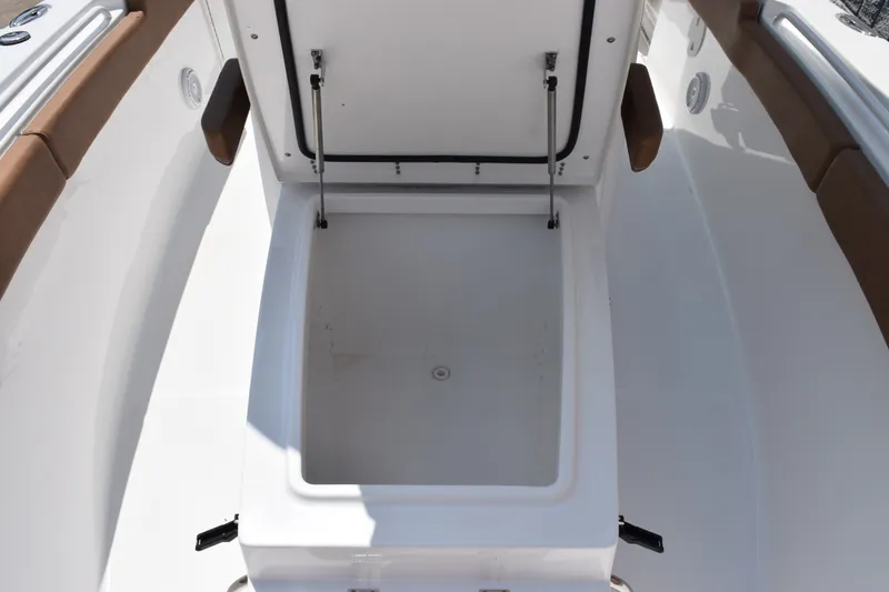 Slide: The Image of 2023 Sea Hunt Gamefish 27CB boat storage compartment with open lid. - 22