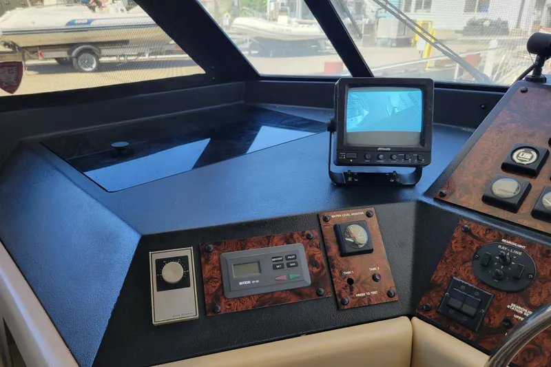 Slide: The Image of Control panel of a 1991 Bayliner 4588 Pilothouse with navigation equipment and monitor. - 19