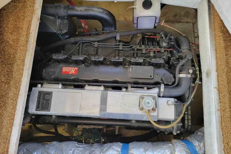 Slide: The Image of Engine compartment of a 1991 Bayliner 4588 Pilothouse, featuring a US Marine engine. - 37