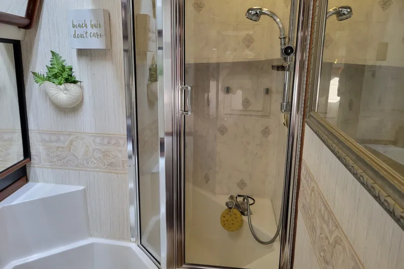 Slide: The Image of Bathroom interior of 1991 Bayliner 4588 Pilothouse with shower and decorative elements. - 35