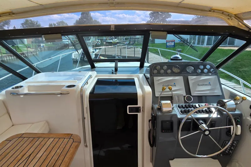 Slide: The Image of Cockpit view of 2000 Tiara Yachts 3100 Open with Garmin navigation system. - 9