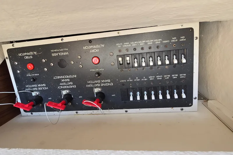 Slide: The Image of Control panel of a 2000 Tiara Yachts 3100 Open, featuring switches and indicators. - 25