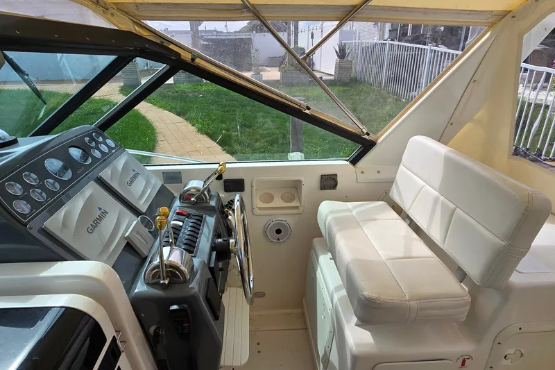 Slide: The Image of Helm of 2000 Tiara Yachts 3100 Open with Garmin navigation system. - 10