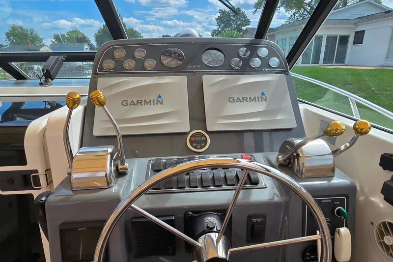 Slide: The Image of Cockpit of 2000 Tiara Yachts 3100 Open with Garmin navigation system. - 12