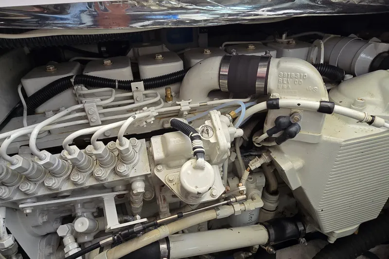 Slide: The Image of Engine compartment of a 2000 Tiara Yachts 3100 Open, showcasing detailed mechanical components. - 29
