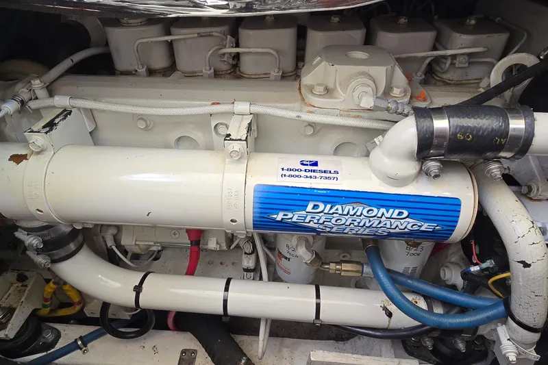 Slide: The Image of Engine compartment of a 2000 Tiara Yachts 3100 Open, featuring Diamond Performance Series components. - 27