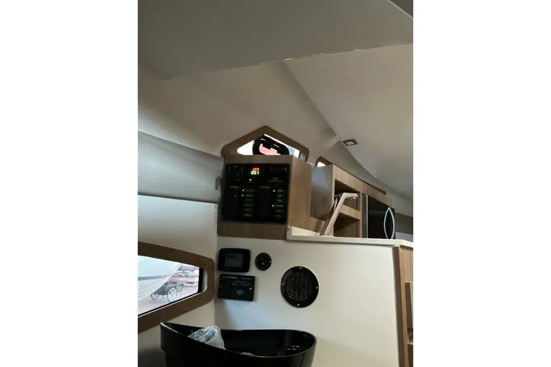 Slide: The Image of Interior of 2027 NX Boats 350 Maximus, featuring control panel and modern design elements. - 22