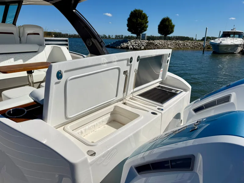 Slide: The Image of The image shows the deck of a 2027 Tiara Yachts 39LS with an open cooler. - 8