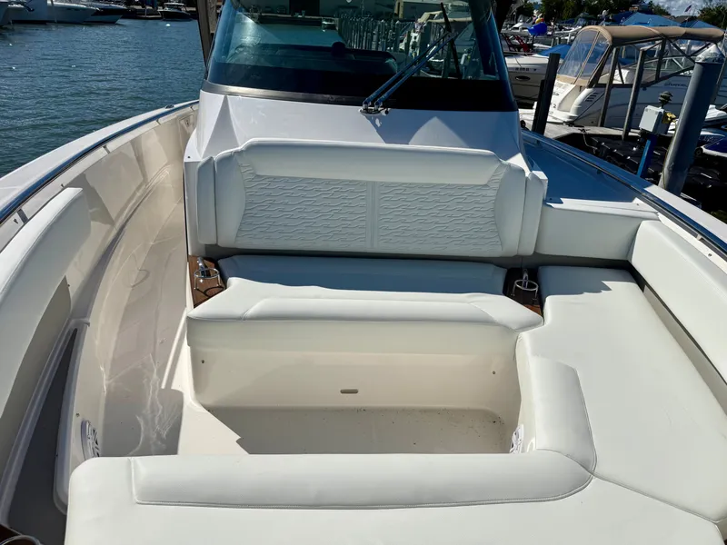 Slide: The Image of The image shows the cockpit of a 2027 Tiara Yachts 39LS with white upholstery. - 20