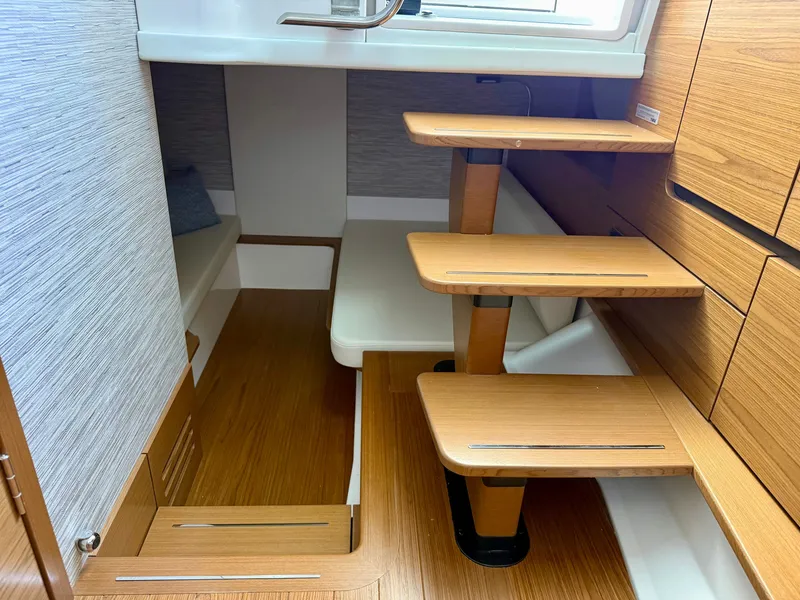 Slide: The Image of Interior of a 2027 Tiara Yachts 39LS with wooden steps and modern design. - 33