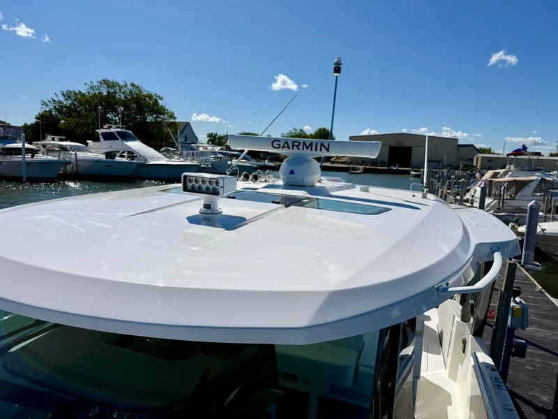 Slide: The Image of The image shows the roof of a 2027 Tiara Yachts 39LS with a Garmin radar. - 22