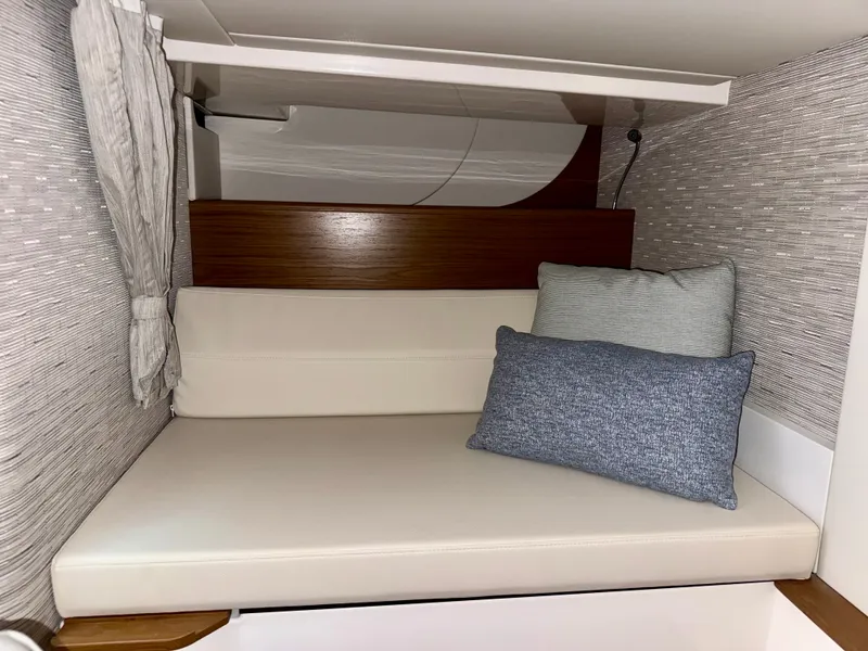 Slide: The Image of Interior of the 2027 Tiara Yachts 39LS with beige seating area and cushions. - 31