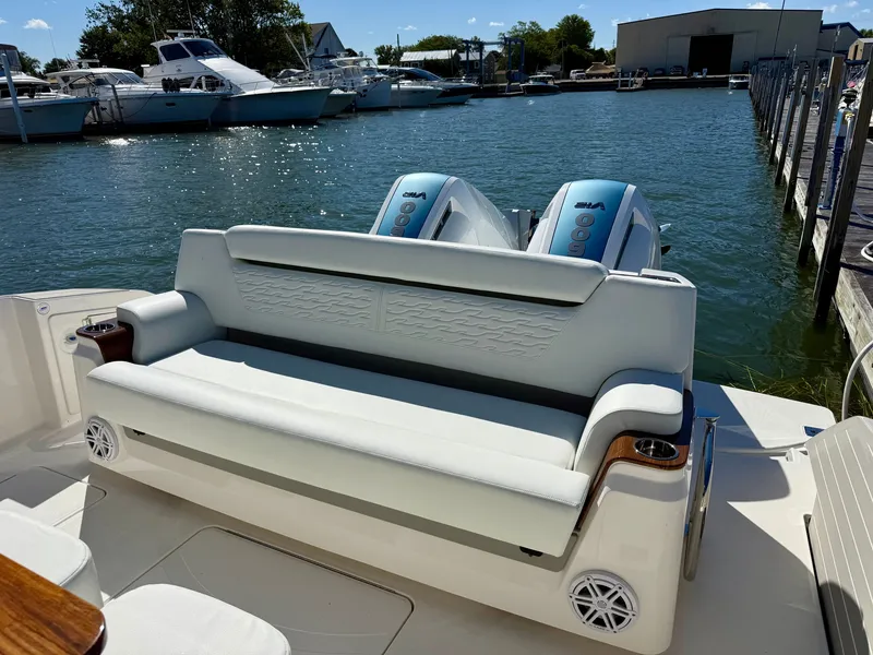 Slide: The Image of The 2027 Tiara Yachts 39LS features a sleek rear bench seat overlooking the marina. - 10