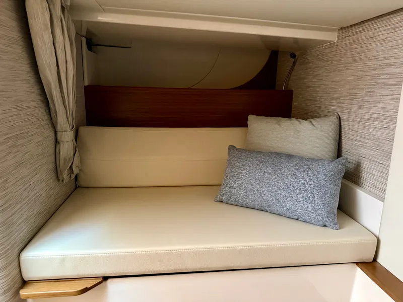 Slide: The Image of Interior of the 2027 Tiara Yachts 39LS with beige sofa and cushions, elegant and modern design. - 32