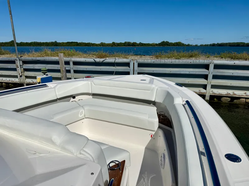 Slide: The Image of 2027 Tiara Yachts 39LS with sleek white seating and a clear view of the water. - 17