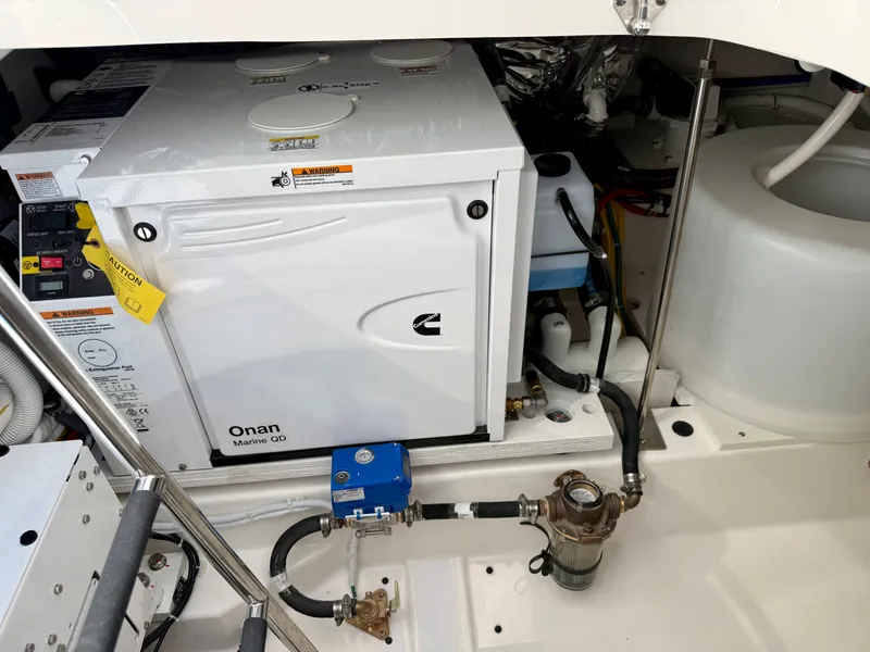 Slide: The Image of The engine room of a 2027 Tiara Yachts 39LS features an Onan Marine generator. - 37