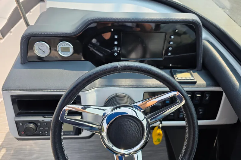 Slide: The Image of Steering wheel and dashboard of 2018 Regal 2300 RX Surf boat. - 5