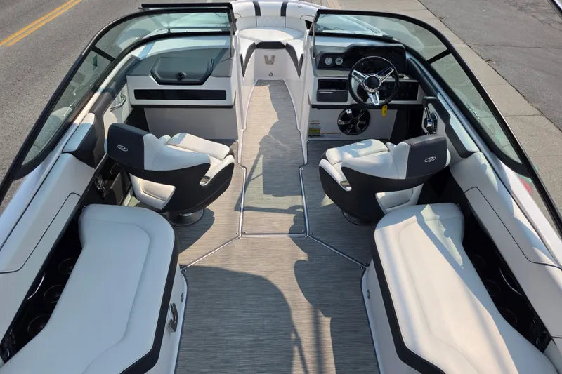 Slide: The Image of 2018 Regal 2300 RX Surf boat interior with sleek seating and modern dashboard design. - 4