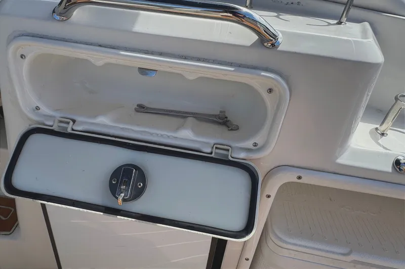 Slide: The Image of Open storage compartment on 2010 Regal 2860 Window Express boat. - 13