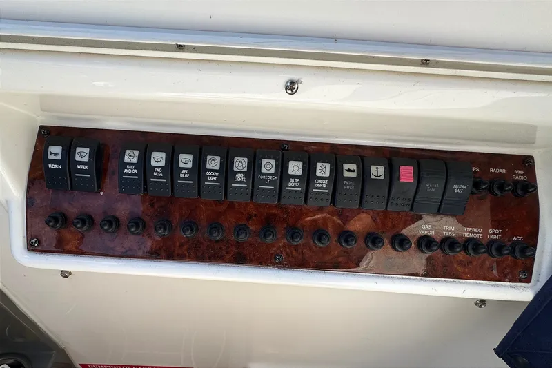 Slide: The Image of Control panel of a 2010 Regal 2860 Window Express boat with labeled switches. - 7
