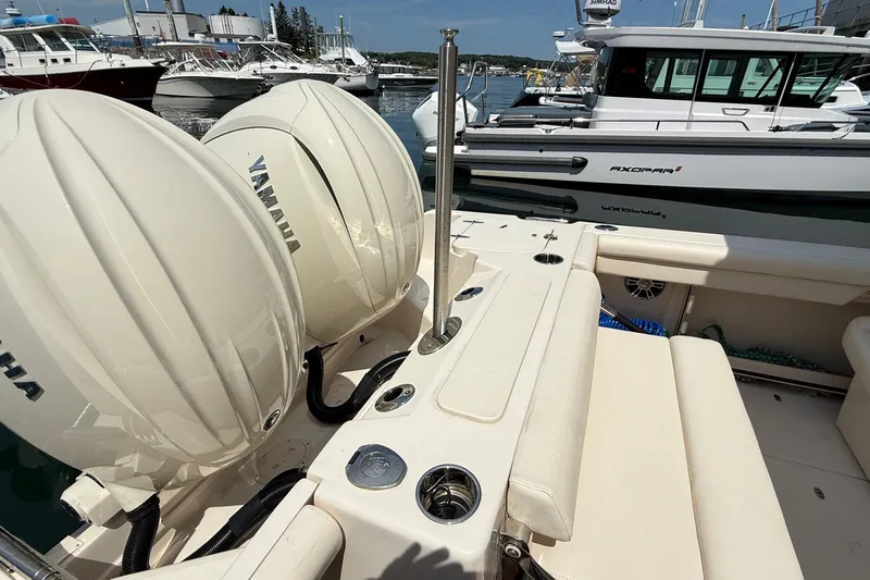Slide: The Image of 2024 Grady-White Freedom 255 boat with Yamaha engines docked at marina. - 11