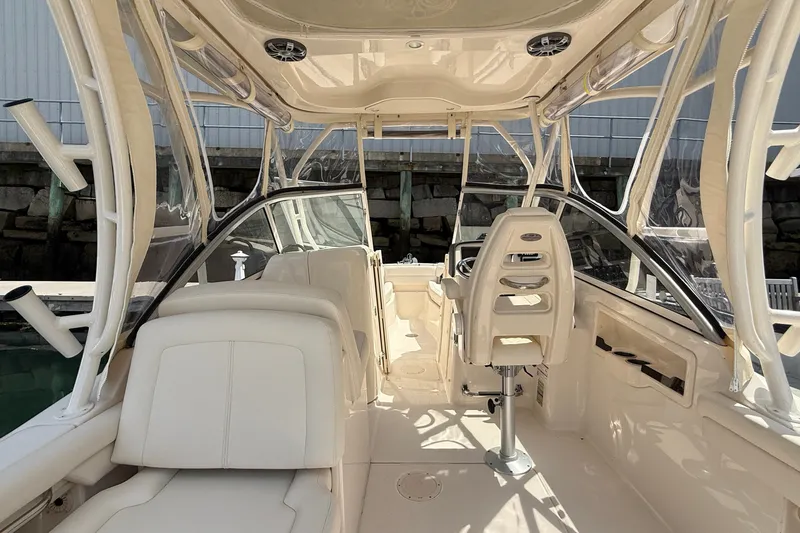 Slide: The Image of 2024 Grady-White Freedom 255 boat interior with sleek seating and modern helm design. - 8