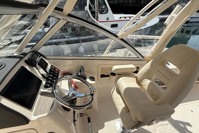 Slide: The Image of 2024 Grady-White Freedom 255 boat interior with helm and luxurious seating. - 4