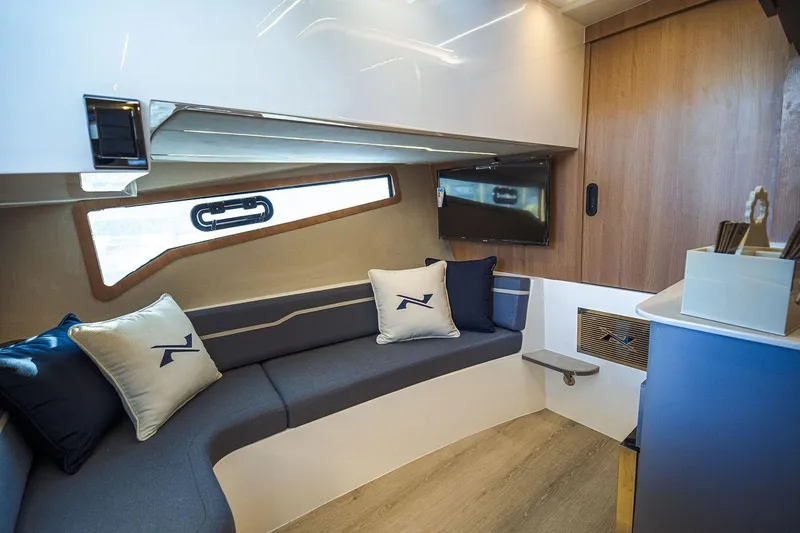 Slide: The Image of Manufacturer Provided Image: 2025 NX Boats 41 Horizon interior with modern seating and stylish decor. - 5