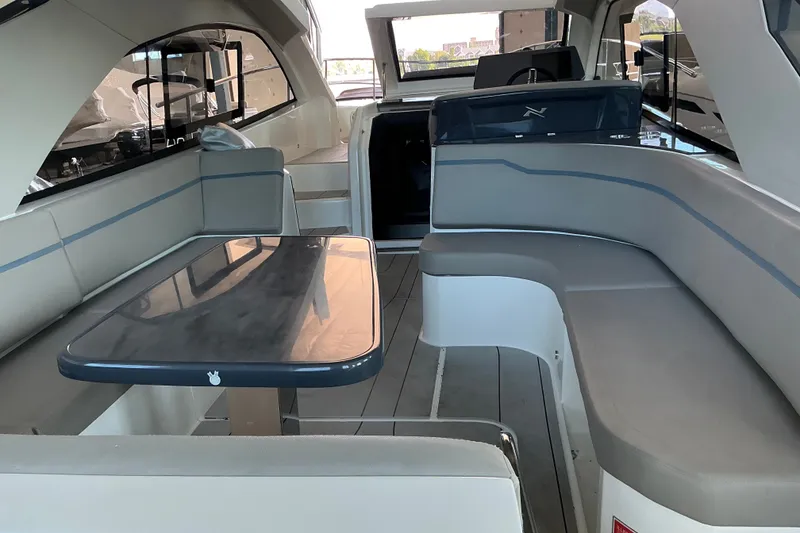 Slide: The Image of Interior of 2027 NX Boats 41 Horizon, featuring sleek seating and modern design. - 15