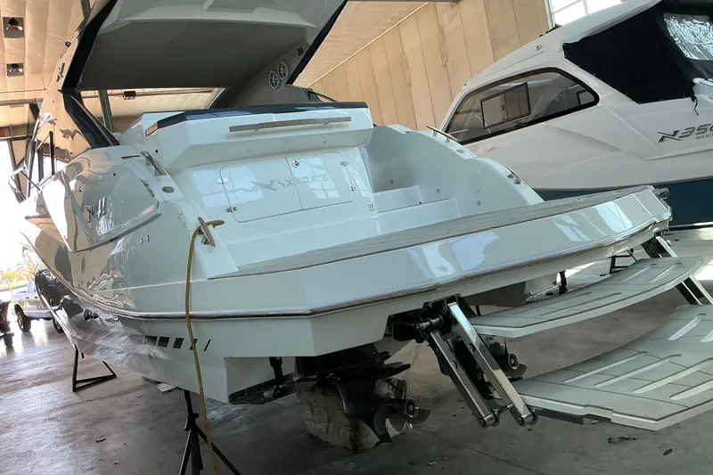 Slide: The Image of 2027 NX Boats 41 Horizon yacht in a showroom, showcasing sleek design and modern features. - 13