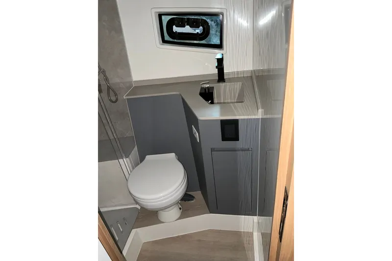 Slide: The Image of Modern bathroom interior on 2027 NX Boats 41 Horizon, featuring sleek fixtures and compact design. - 37